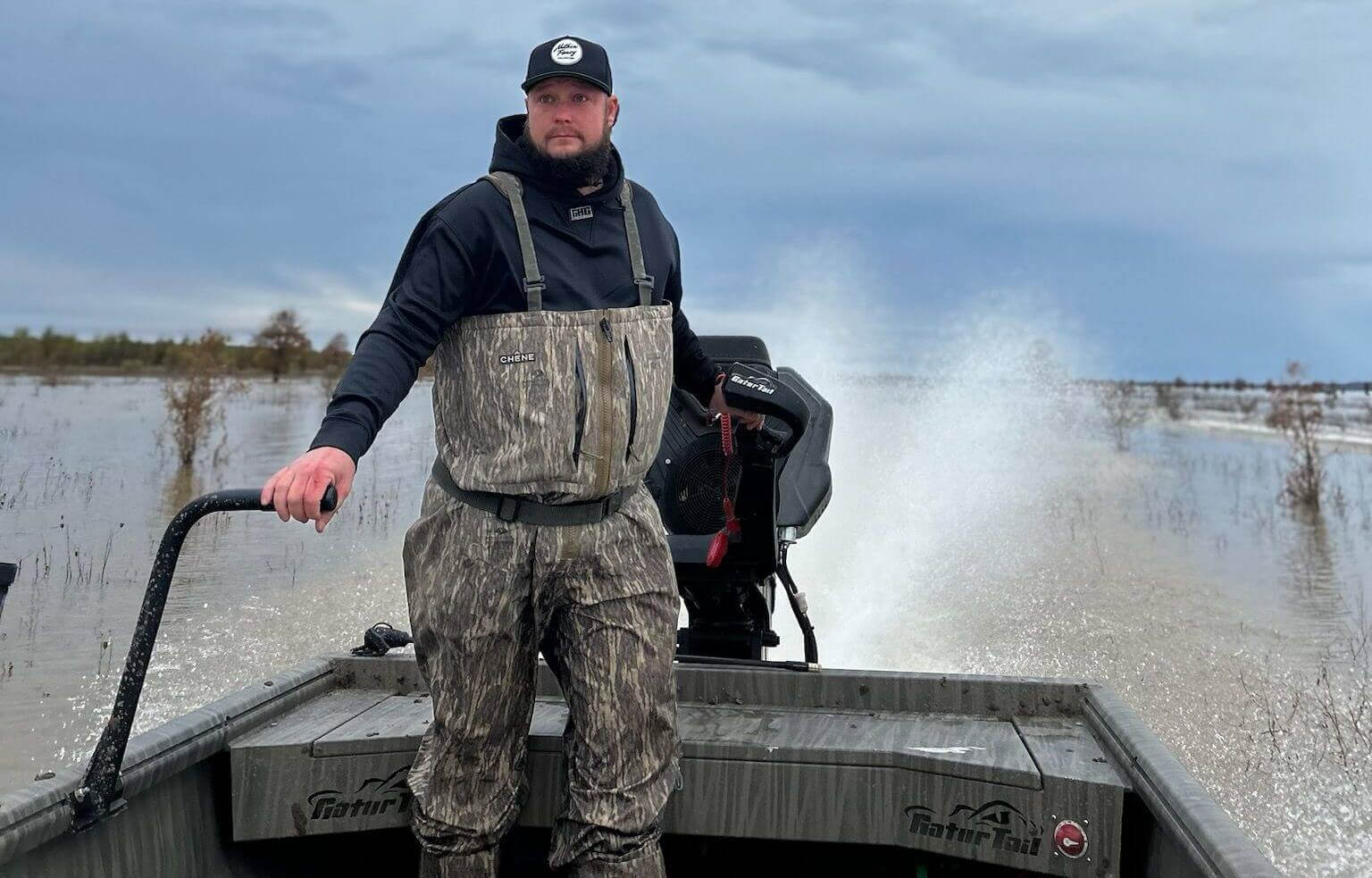 Matt Westberry, owner of Legendary Outfitters, standing in waders outdoors